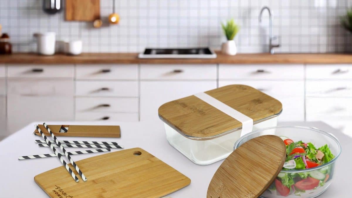 Bamboo chopping board, bamboo cutlery and glass lunch boxes with bamboo lids from the Impact Aware collection